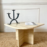 Travertine coffee table in eye shape.