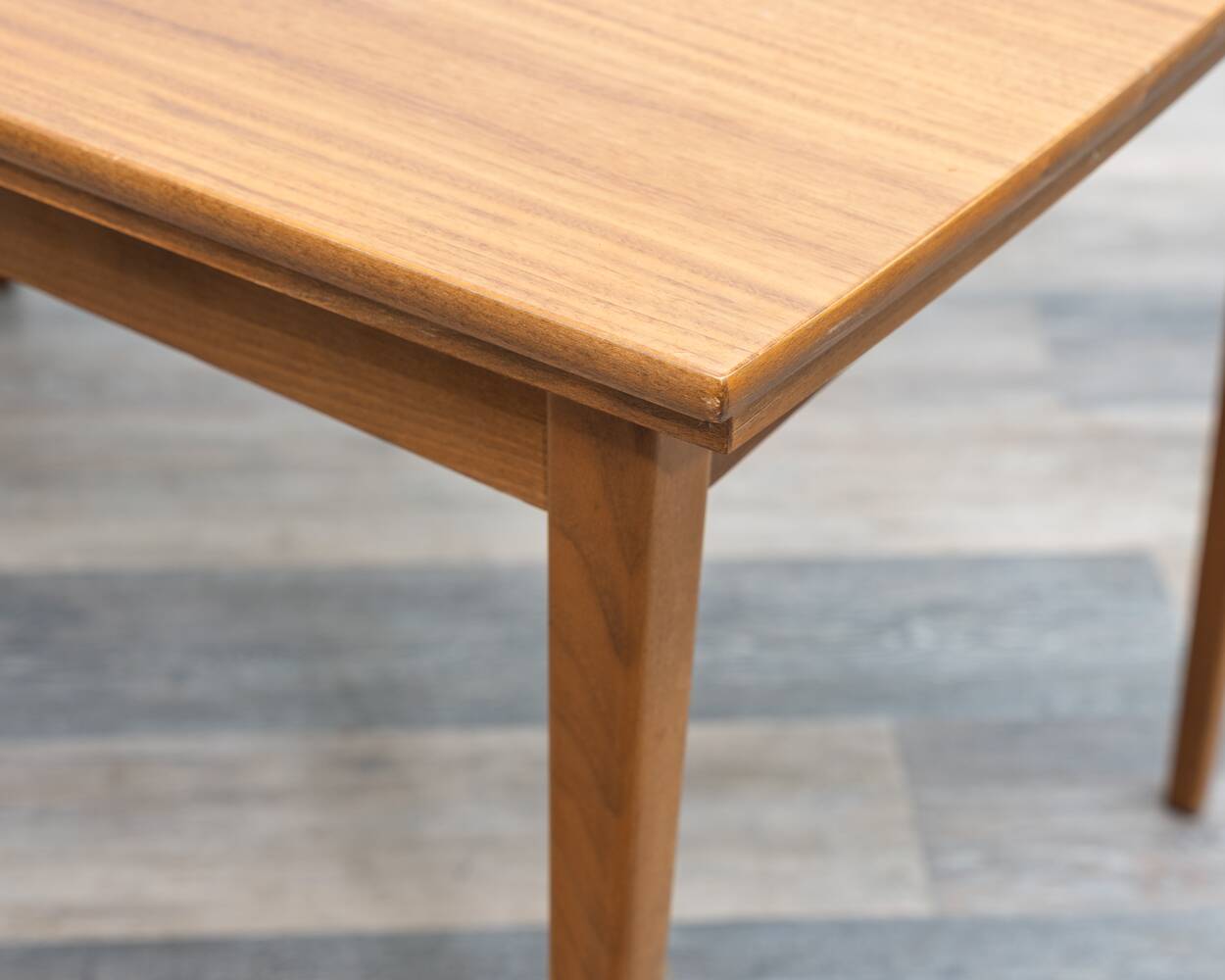 Dining table, 1960s, in walnut, slightly elliptical shape.