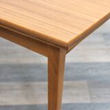 Dining table, 1960s, in walnut, slightly elliptical shape.