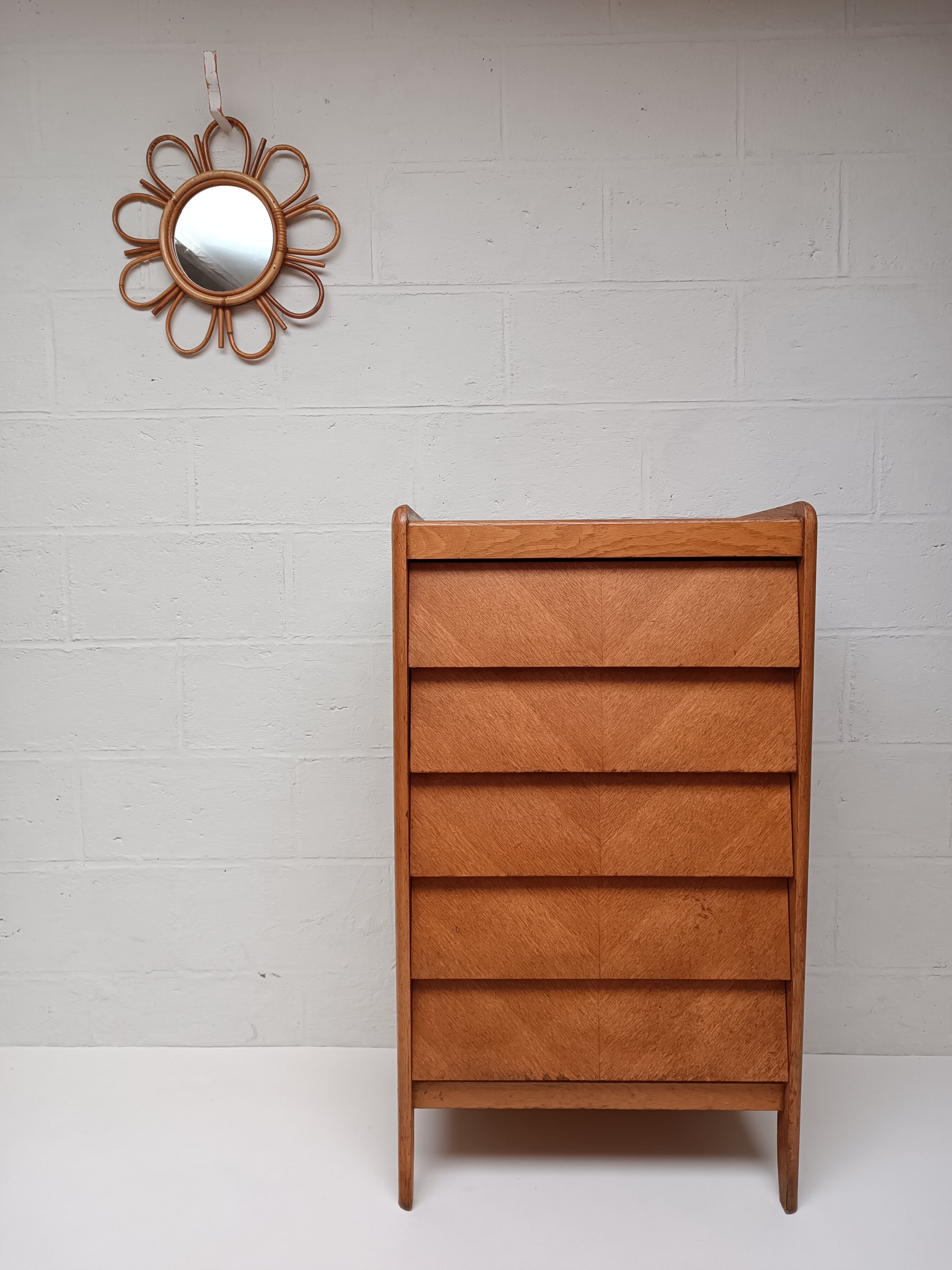High wooden chest of drawers in the 50s