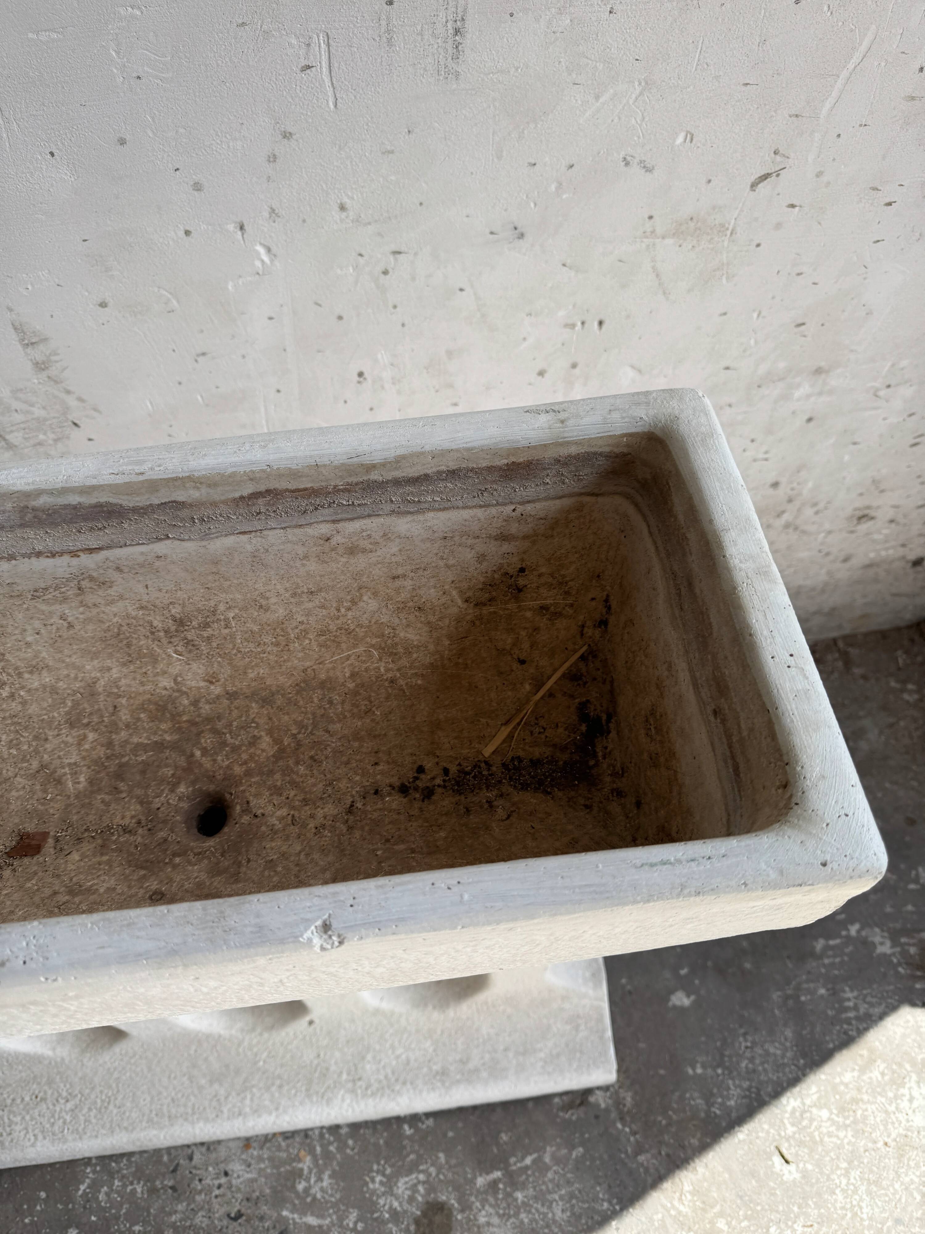 Pair of sculptural cast concrete planters in Off-White, mid-century brutalist style, long and rectangular.