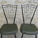 Pair of black metal chairs and khaki green skai, 60s