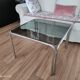 Table basse piètement chromé et plateau en verre fumé noir