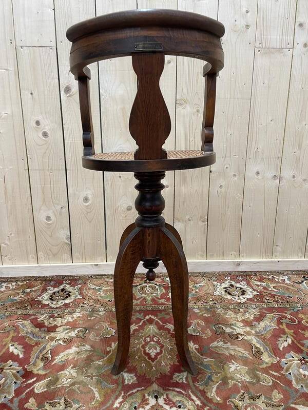 Fauteuil de coiffeur en cannnage Paul Tournay