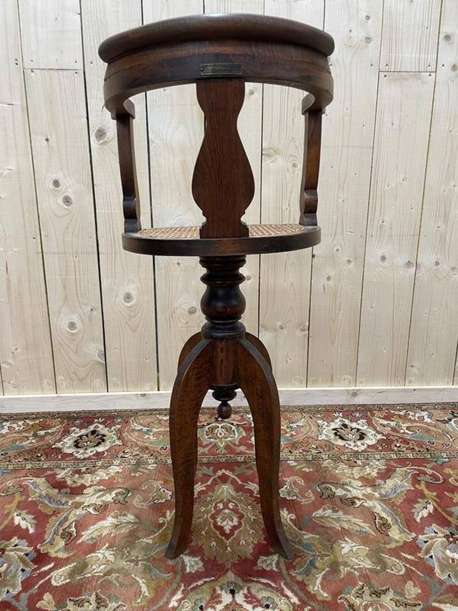 Fauteuil de coiffeur en cannage Paul Tournay