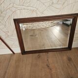 Beveled glass mirror in its wooden frame