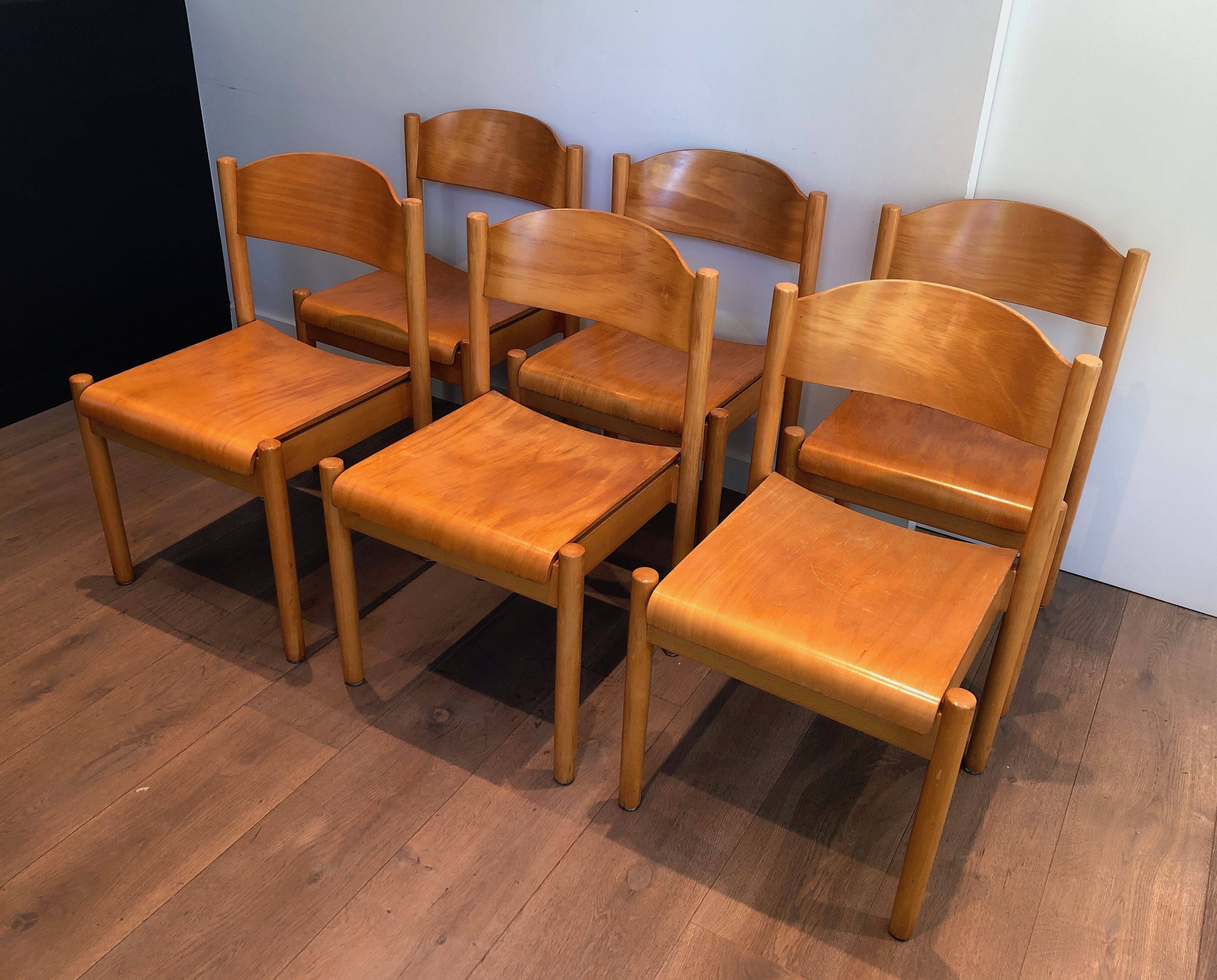 Set of 6 stackable chairs in fir wood.