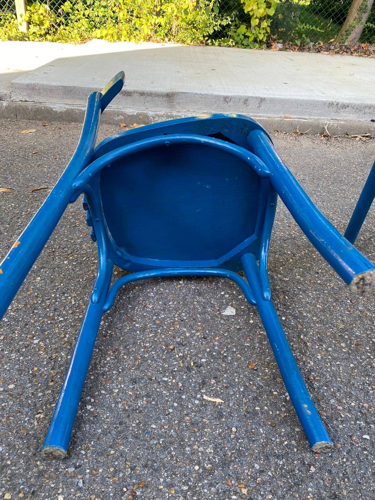 2 blue bistro chairs in curved solid wood