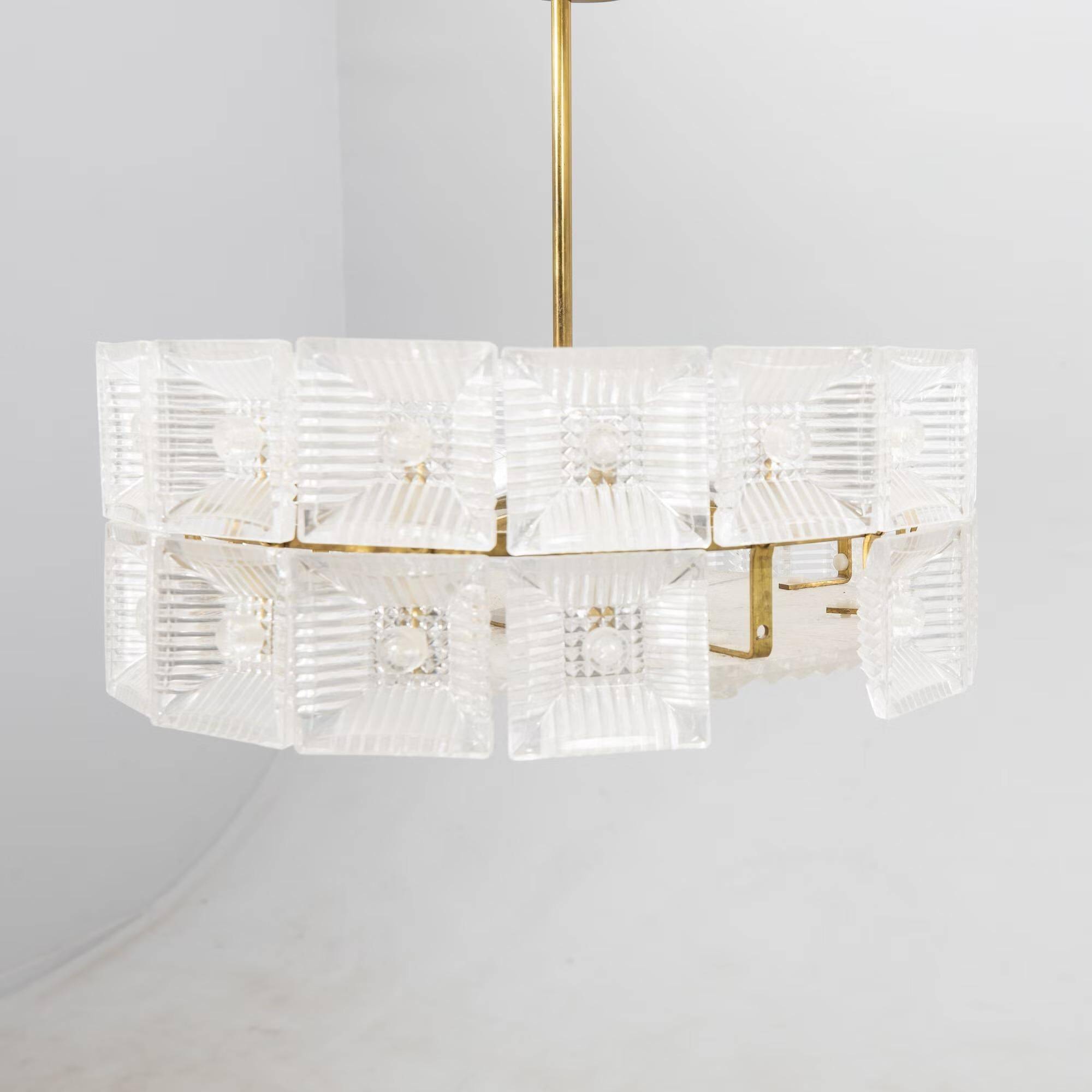Suspended glass and brass lamp by Carl Fagerlund for Orrefors, Sweden, 1960.