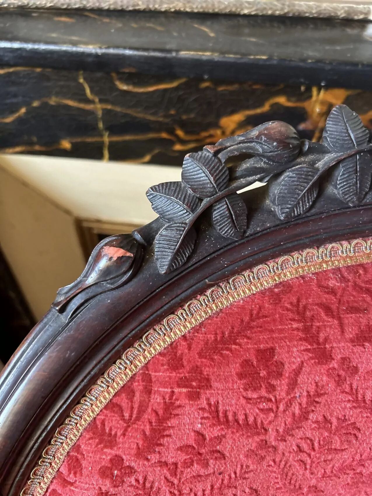 Napoleon III medallion armchair in carved wood and red velvet.