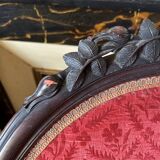 Napoleon III medallion armchair in carved wood and red velvet.