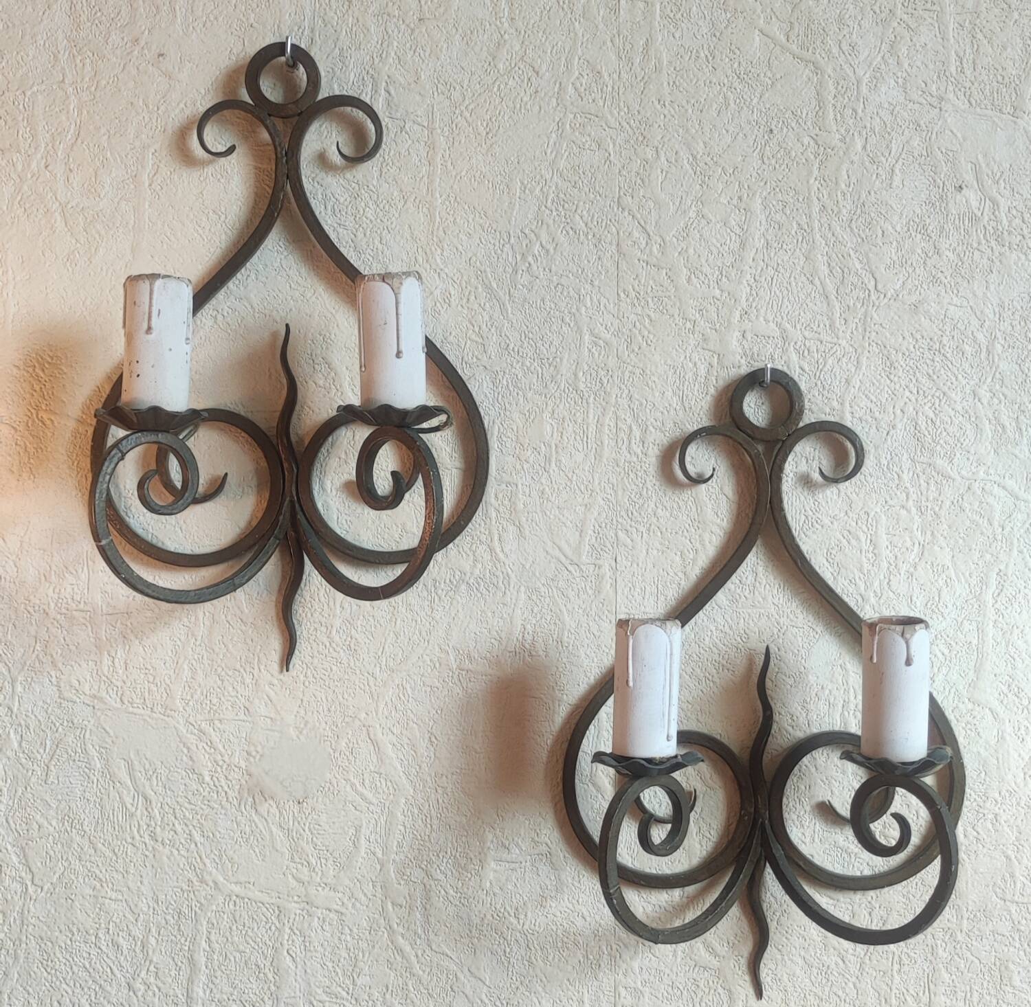 Old pair of wrought iron wall lights