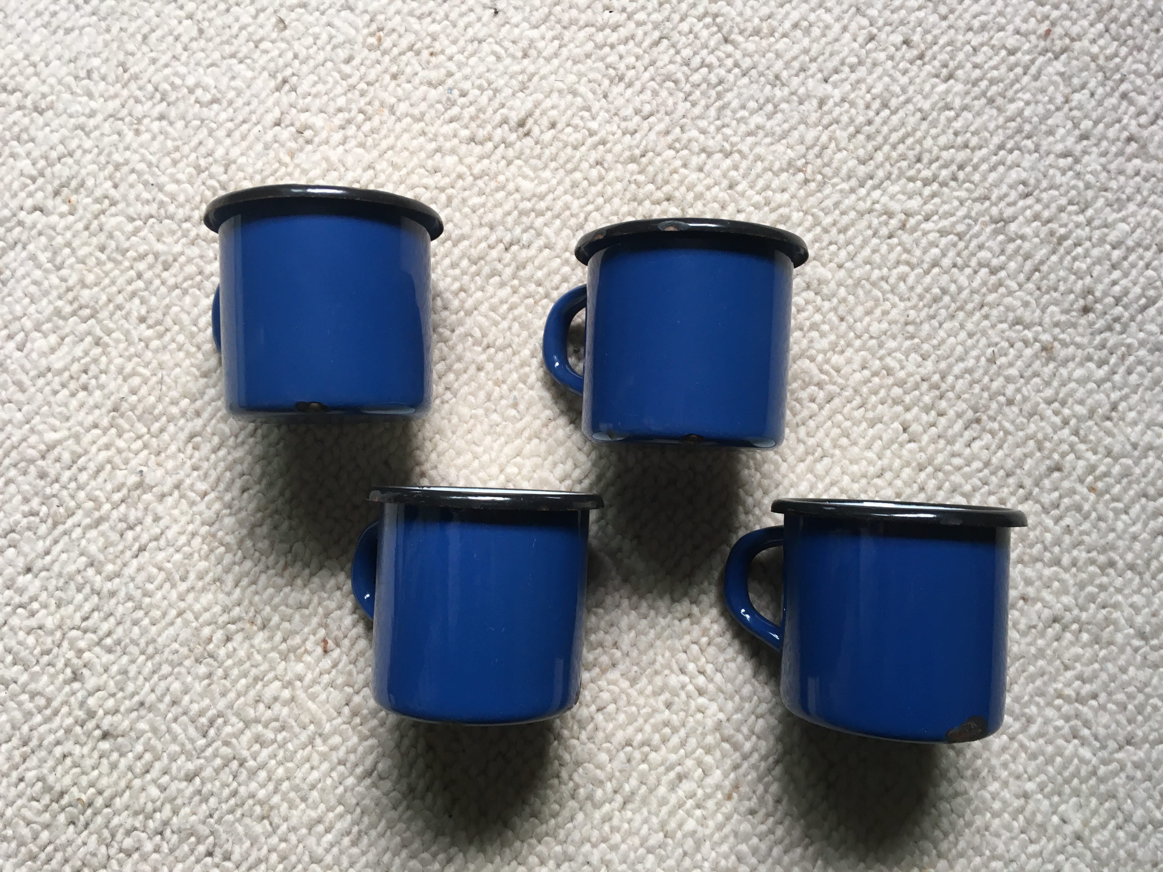 Batch of 4 enamelled sheet metal mugs