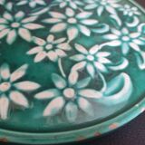 Dessous de plat vert à fleurs