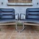 Pair of vintage leather and aluminum armchairs, restored