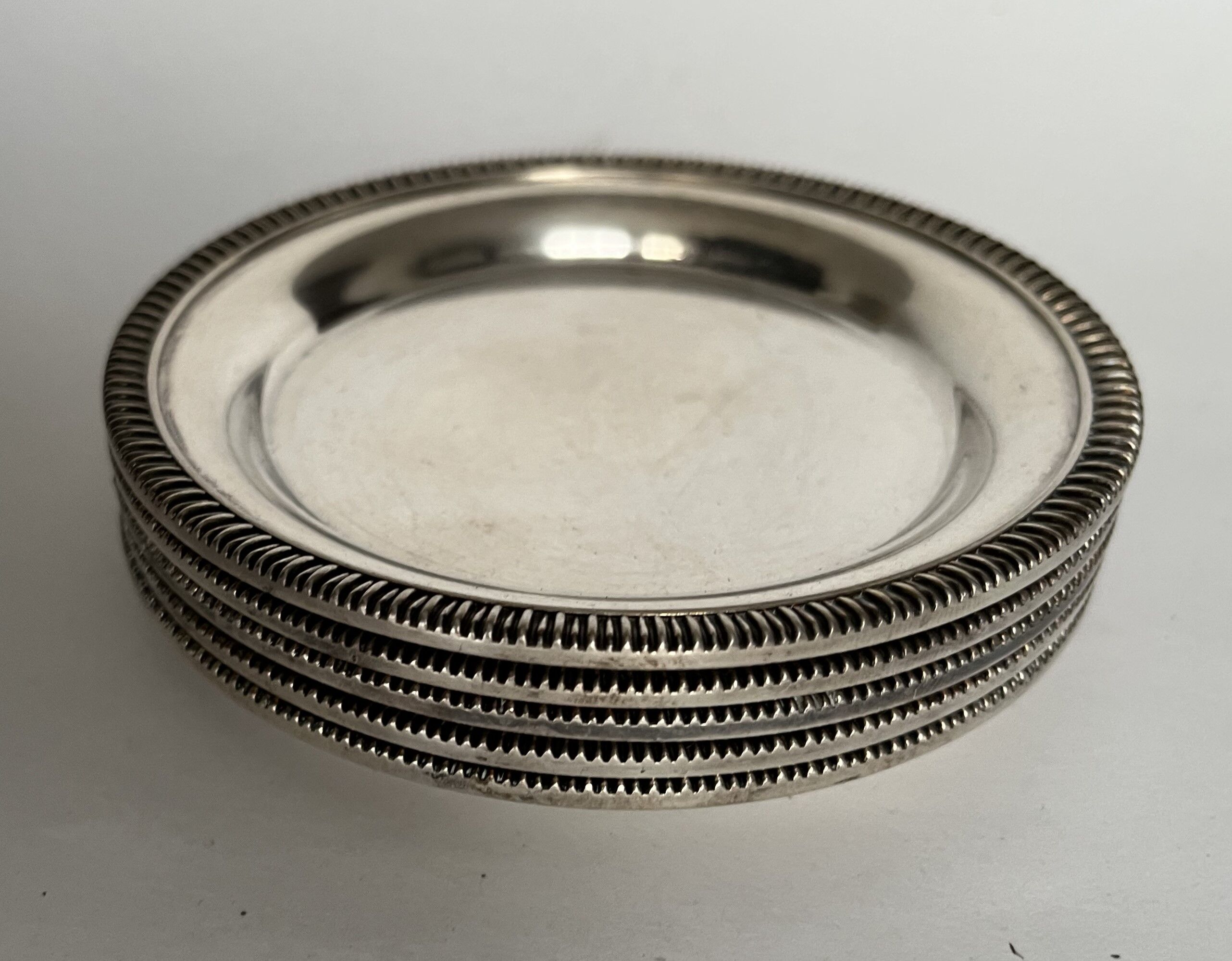Set of 5 silvered metal coasters