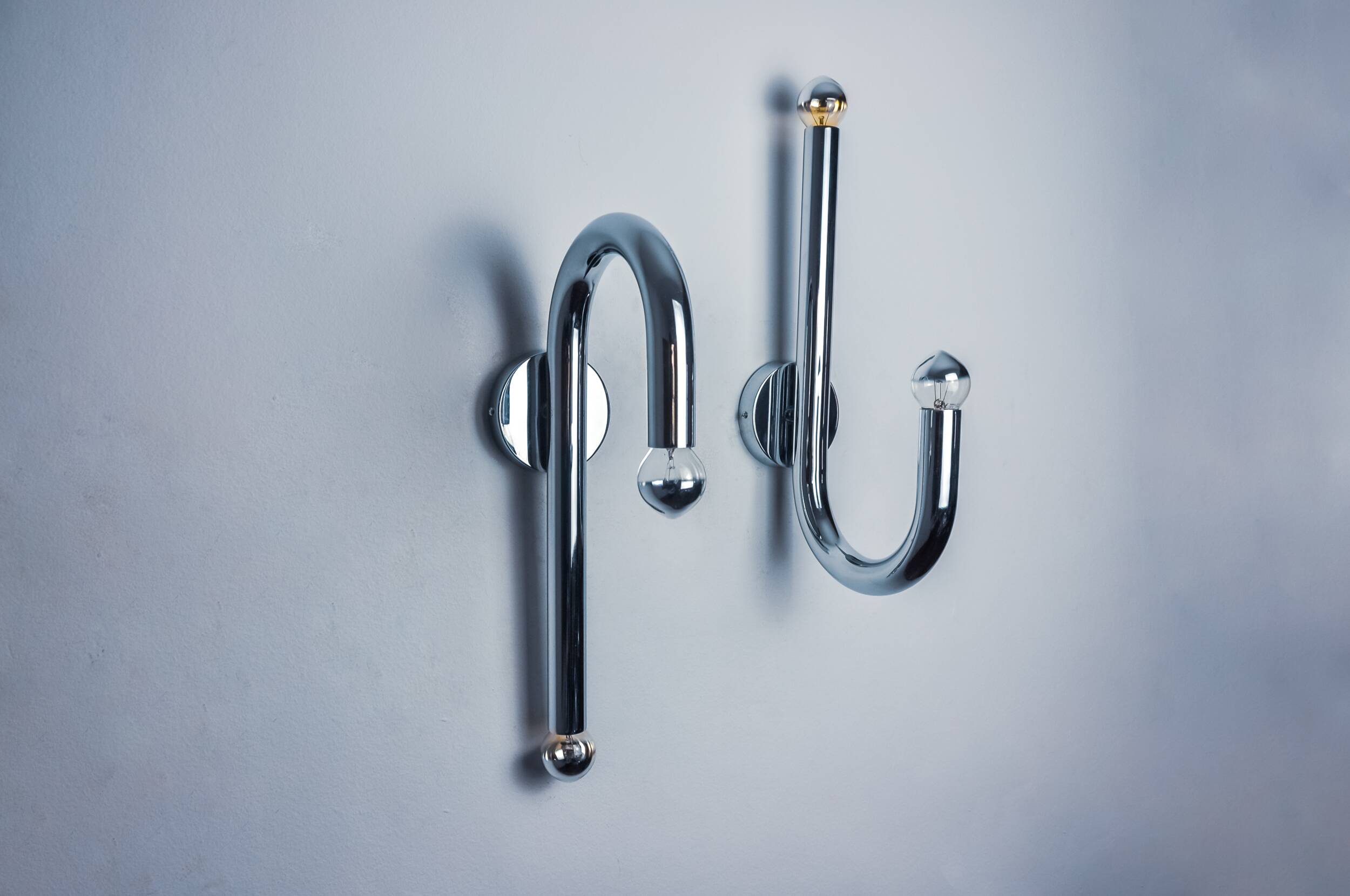 Pair of space-age tubular wall lights, chromed metal, Italy, 1970
