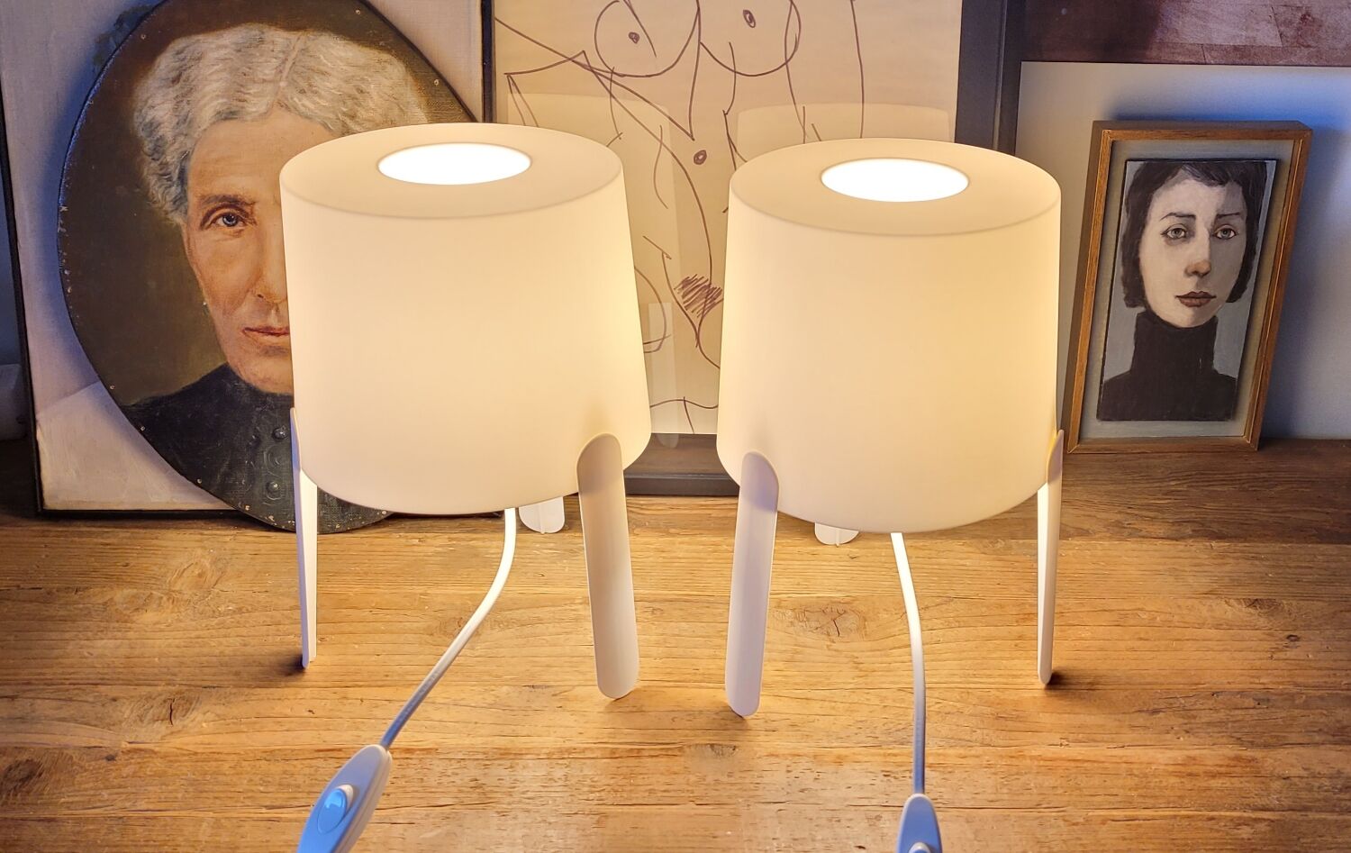 Pair of white Ikea Tvärs bedside lamps