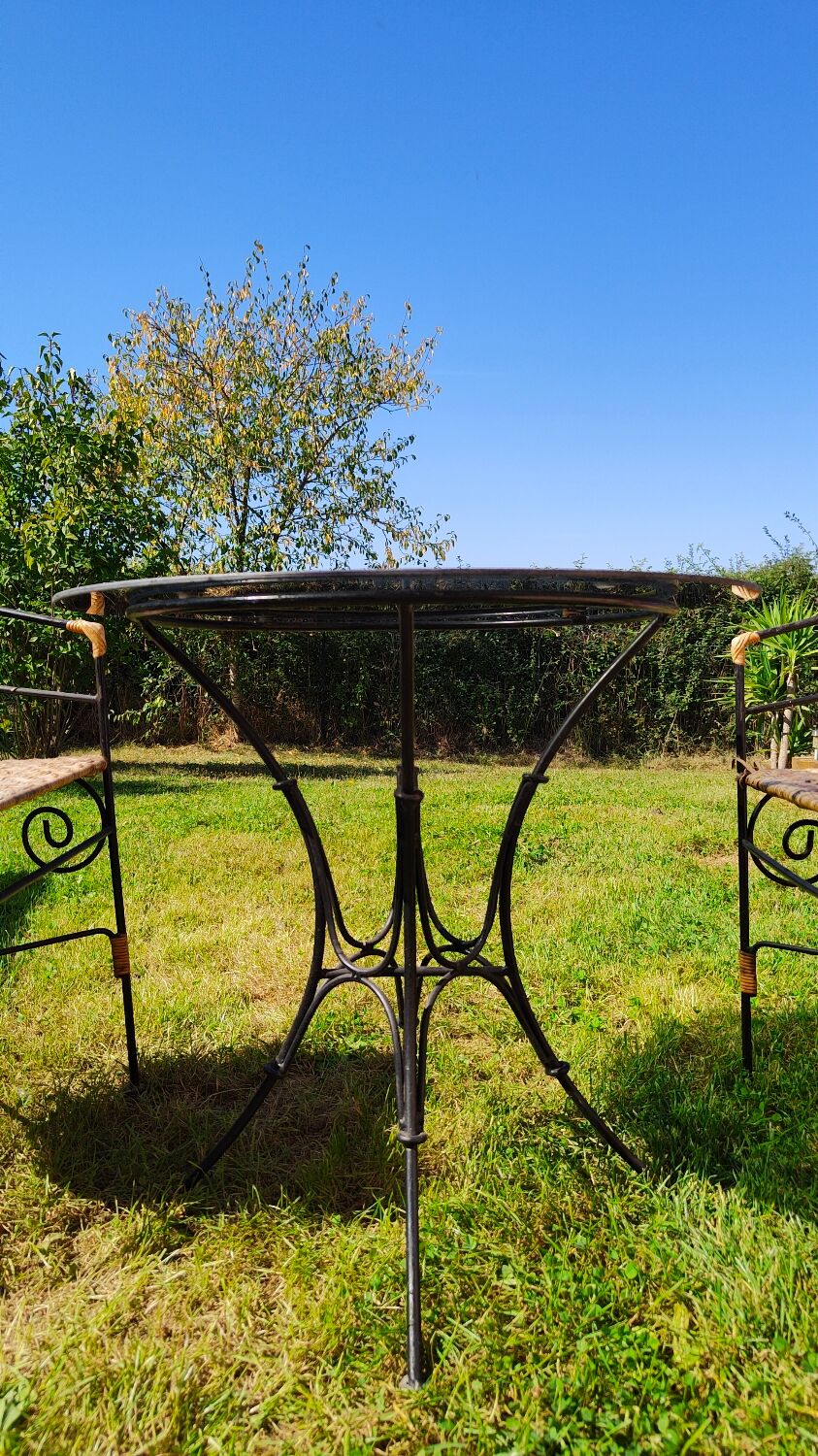 Garden table and wrought iron chair