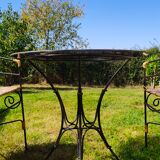 Garden table and wrought iron chair