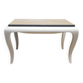 Oak coffee table with curved legs.