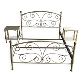 Patinated metal and wood double bed with integrated bedside tables.