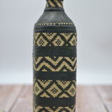 Set of 2 decorative vintage bottles covered with leather & wicker