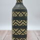Set of 2 decorative vintage bottles covered with leather & wicker