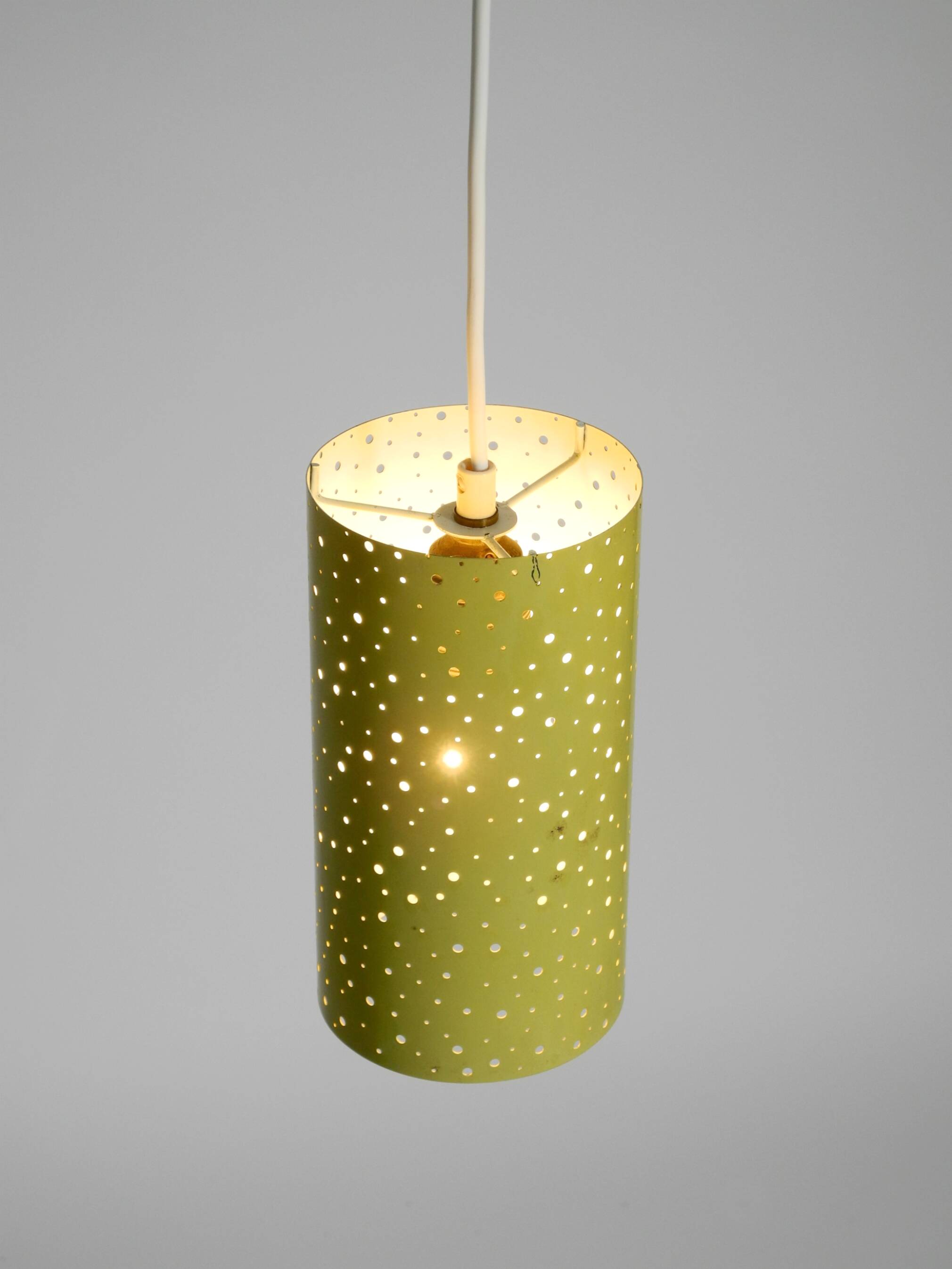 1950s pendant lamp in perforated metal, mustard yellow, by Ernest Igl