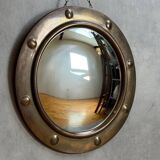 50s French porthole-style witch mirror with convex glass.