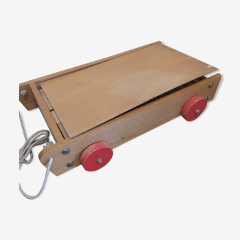 Old wooden cart with building blocks
