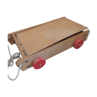 Old wooden cart with building blocks