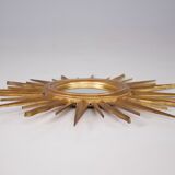 Sun mirror in gilded wood