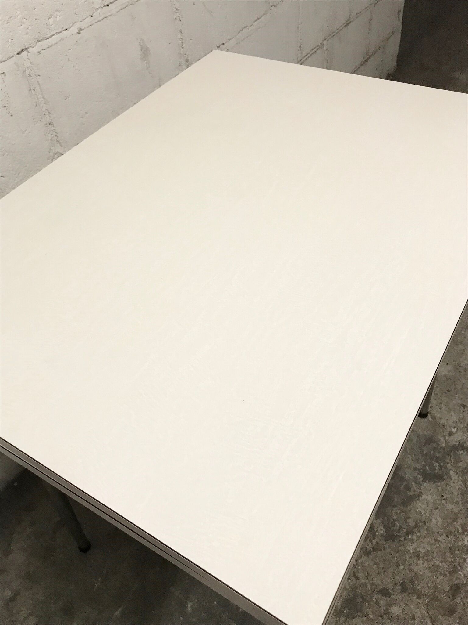 Off-white formica table / 70s cream with a tapered foot drawer