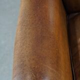 Sheep leather wingback chair with patina