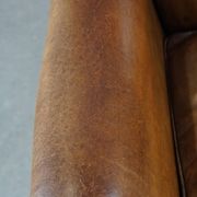 Patinated sheep leather wingback armchair