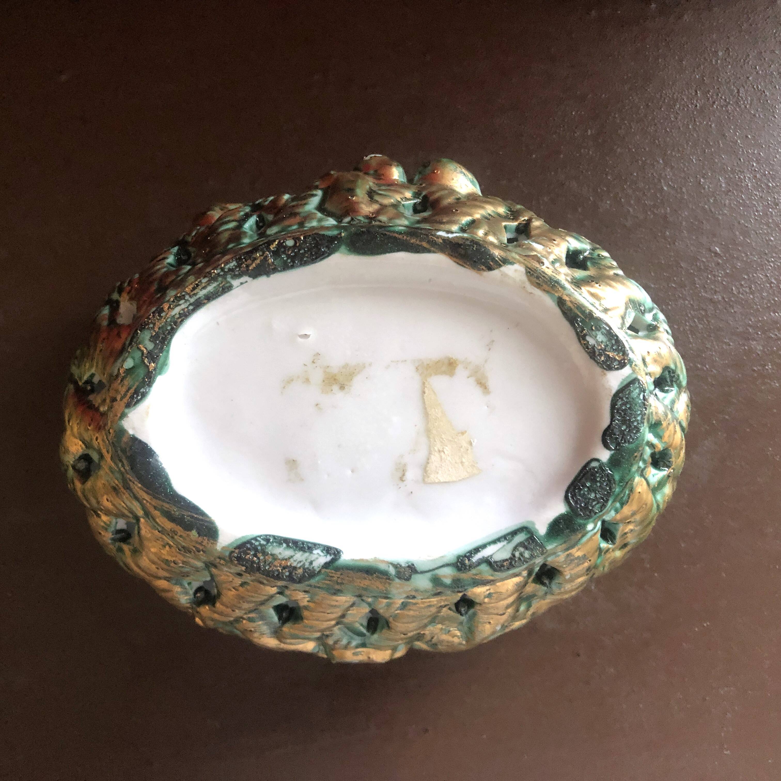 Openwork earthenware candy box with fruit slip