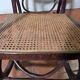 Curved wooden rocking chair with caning