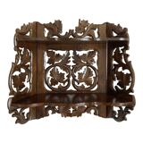 Carved wooden wall shelf