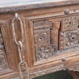 Old wooden console with chains