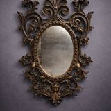 Antique Louis XV style mirror, richly carved with scrollwork, shells, and foliage.