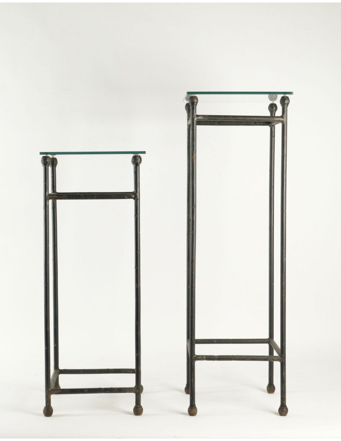 Two consoles, wrought iron sheaths on glass top, twentieth century