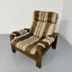 Vintage 1970s design armchair made of wood and fabric.