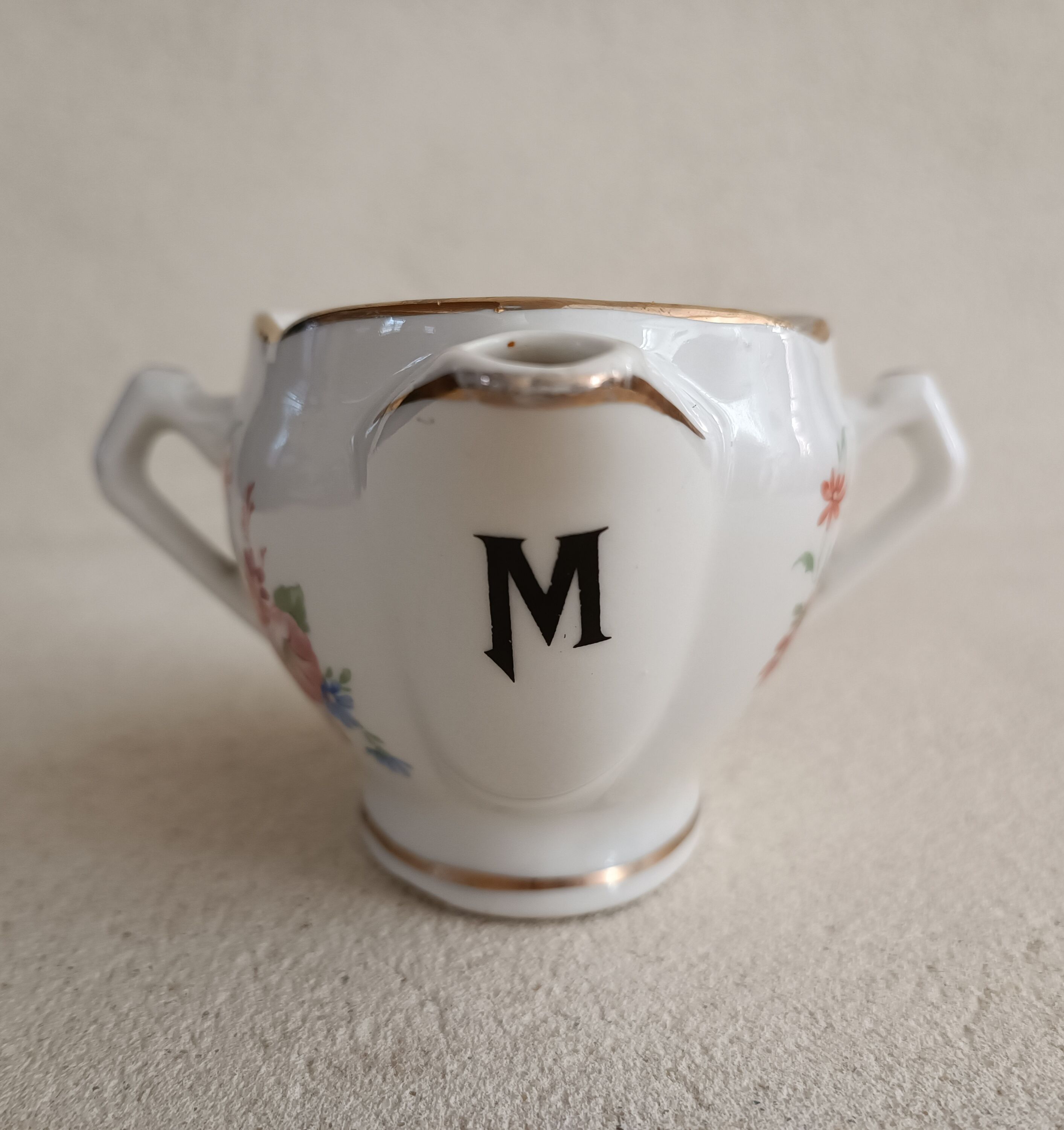 Lean fat sausage in Limoges porcelain