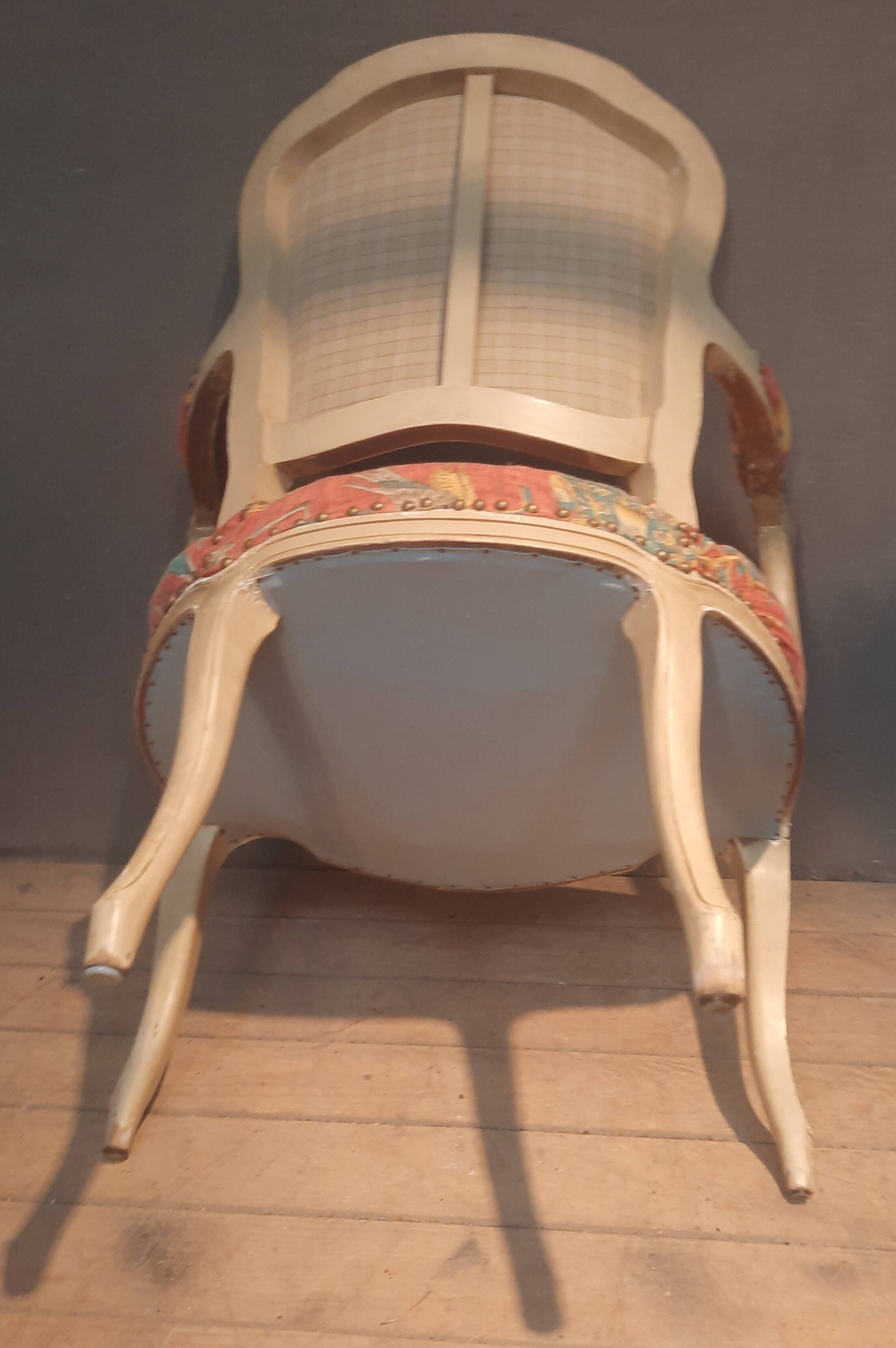 Louis XV style armchair upholstered with an Egyptian pattern.