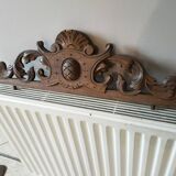 Old carved wooden pediment