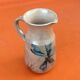 1960s Glazed terracotta pitcher with floral decoration