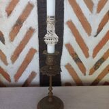 Old candlestick with chiseled bronze collar