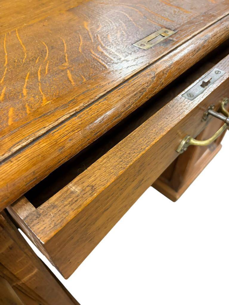 Vintage American desk made of solid wood with a curtain.