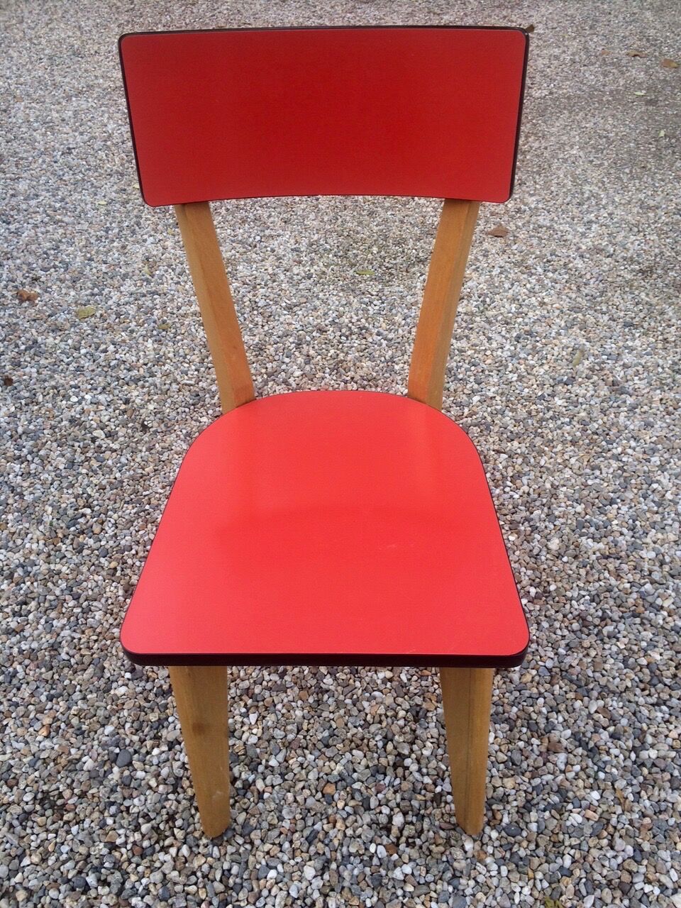 Eight wooden and formica chairs